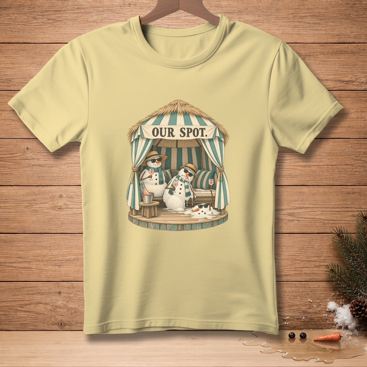 Yellow t-shirt with two snowmen relaxing under a cabana with "OUR SPOT" text.
