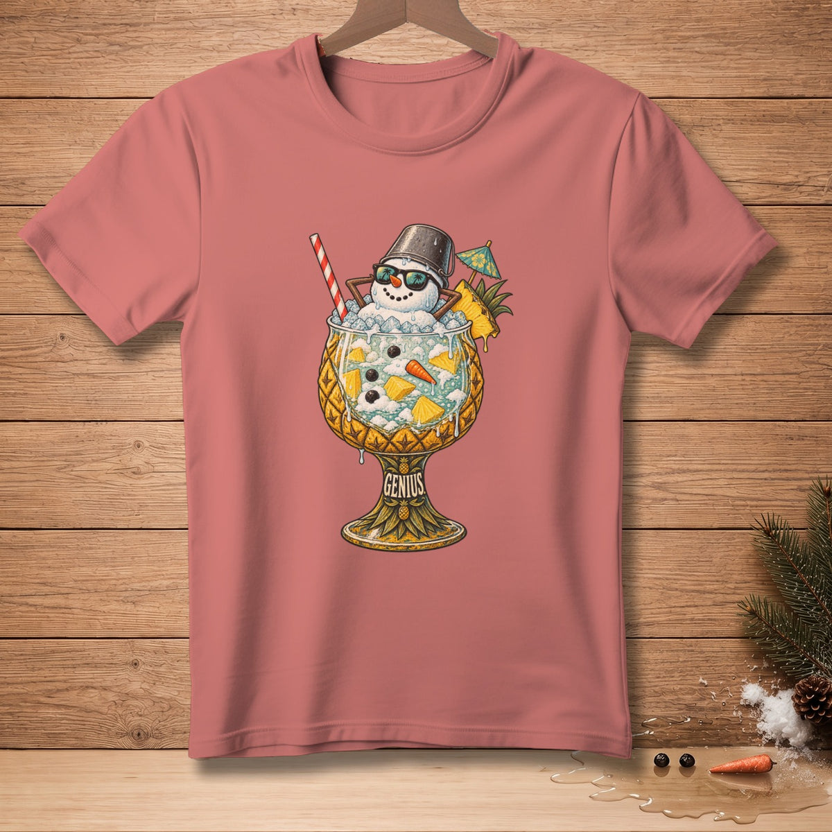 T-shirt with graphic of snowman in a pineapple drink, text "GENIUS".