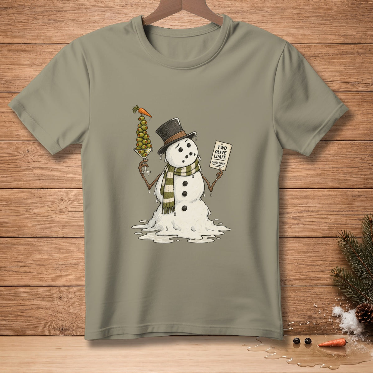 Melting snowman in a hat and scarf holds olive martini and a sign.