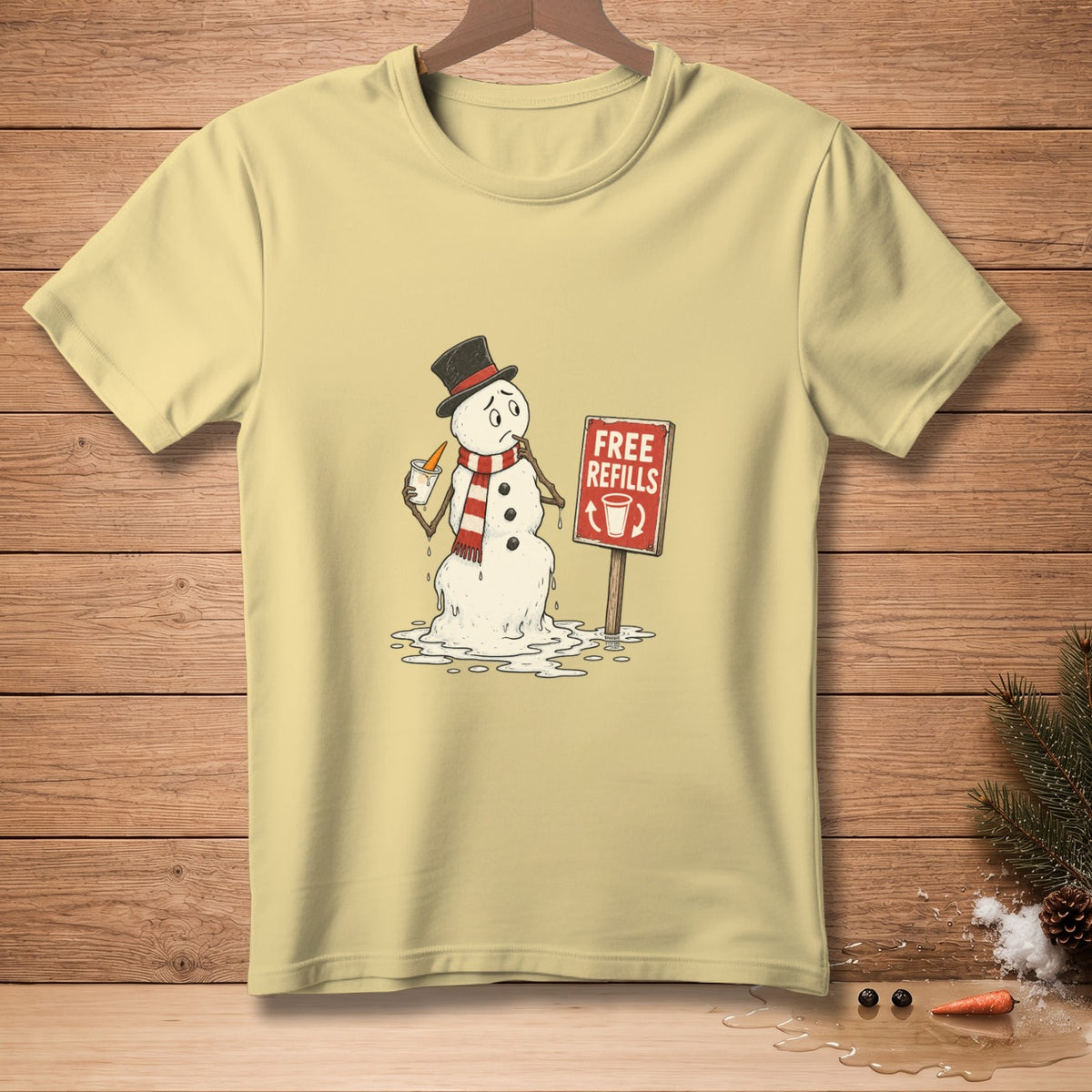 Yellow t-shirt with melting snowman holding carrot stick and free refills sign.