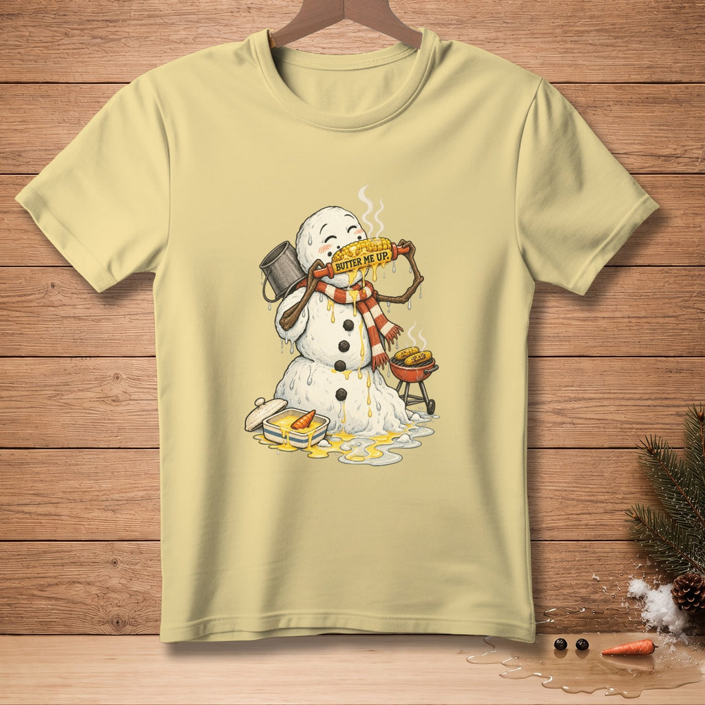 Snowman eating corn on the cob with "Butter Me Up" text.