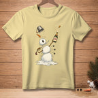 Melting snowman with champagne bottle, sword, and bucket on a pale yellow t-shirt.