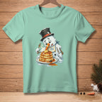 Melting snowman wearing a top hat and bib eating pancakes with a fork and knife.