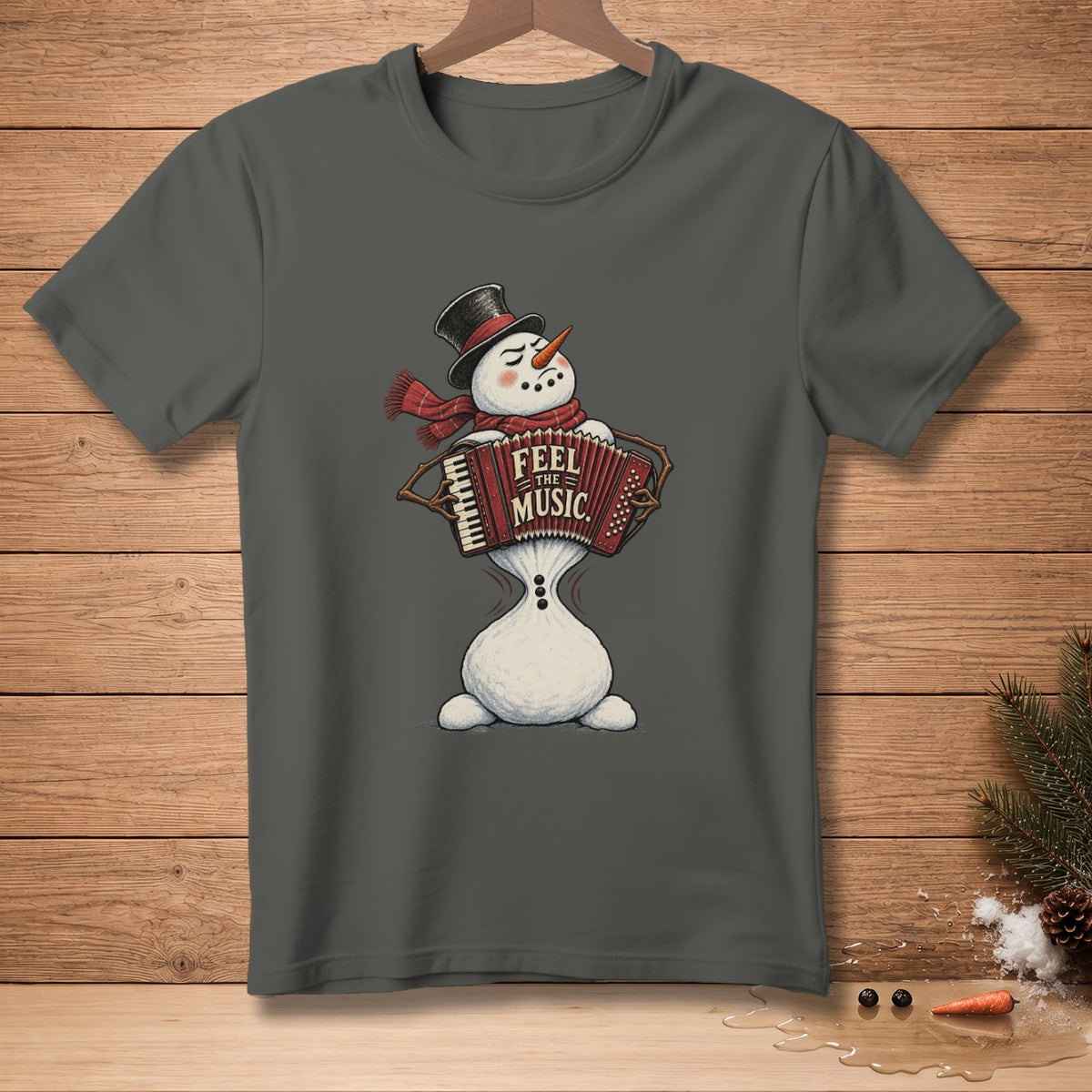 Snowman in top hat and scarf playing accordion with "Feel the Music" text.