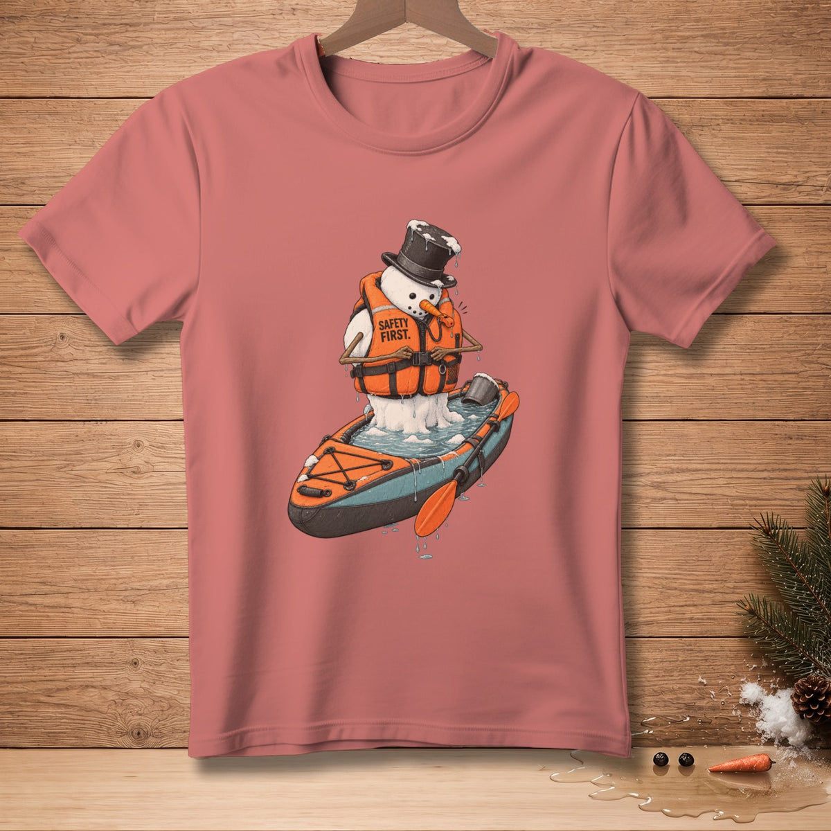 Snowman in kayak wearing life vest with "Safety First" text.