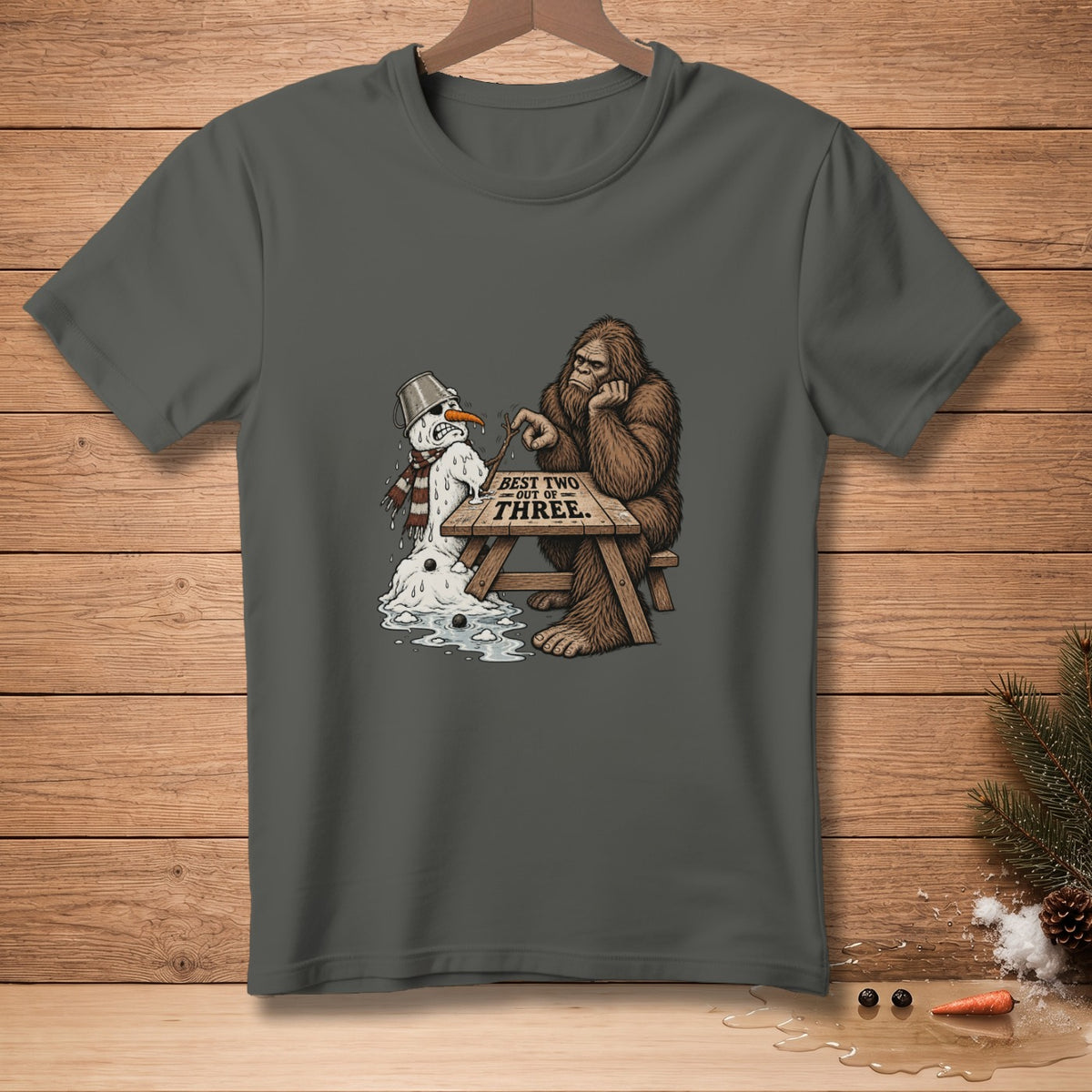 Bigfoot plays a stick game with a melting snowman that reads "BEST TWO OUT OF THREE."