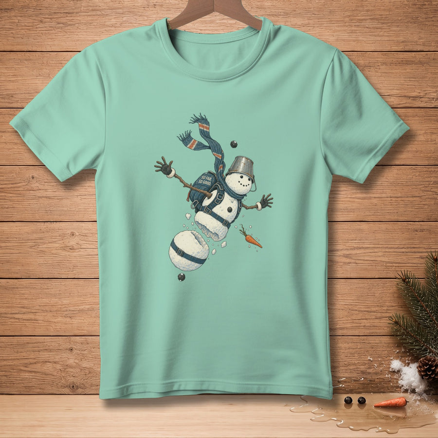 T-shirt with graphic of a falling snowman in pieces with text "SO FAR SO GOOD".
