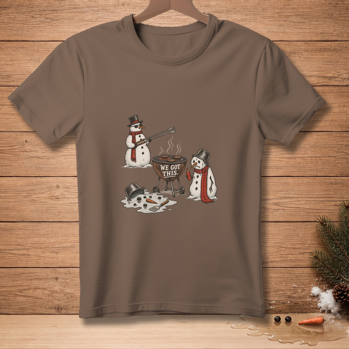 Two snowmen grill burgers and sausages, with text "WE GOT THIS."