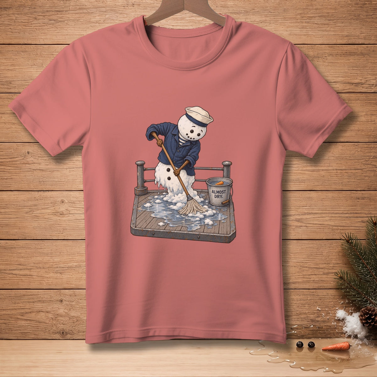 Snowman in sailor attire mopping up a wet deck with a bucket labeled "ALMOST DRY."