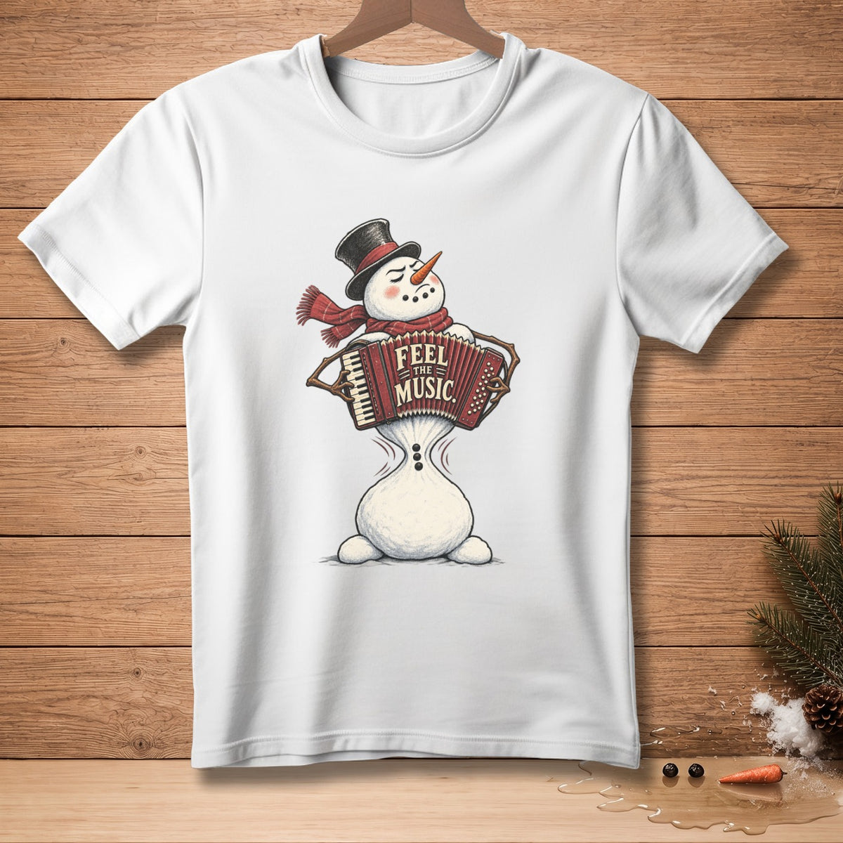 White t-shirt with a snowman playing an accordion with "Feel the Music" text.