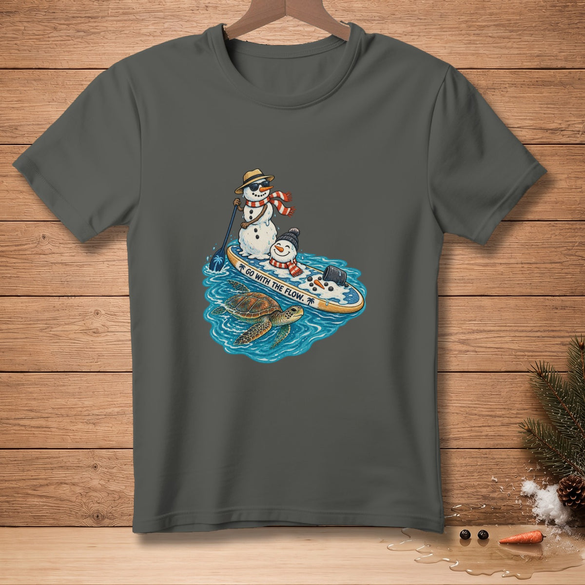 Two snowmen on a paddleboard with a sea turtle, text says "GO WITH THE FLOW."
