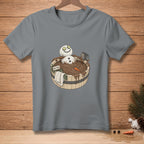 Snowman in a wooden tub of mud, with cucumber eyes and a "Detox" sign.