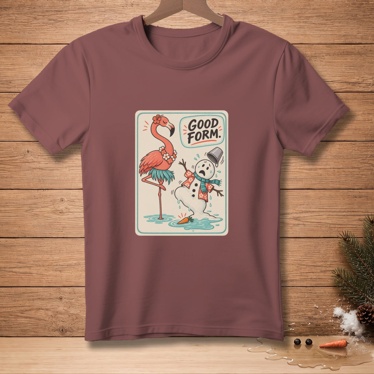 T-shirt with a flamingo and melting snowman graphic that says "GOOD FORM."