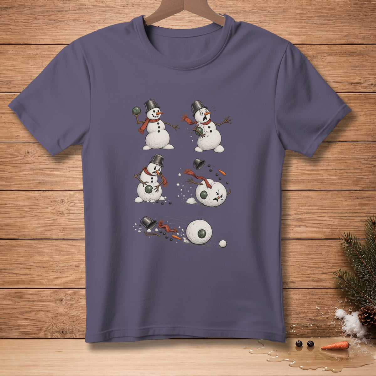 T-shirt with four panel illustration of a snowman being hit by a snowball.