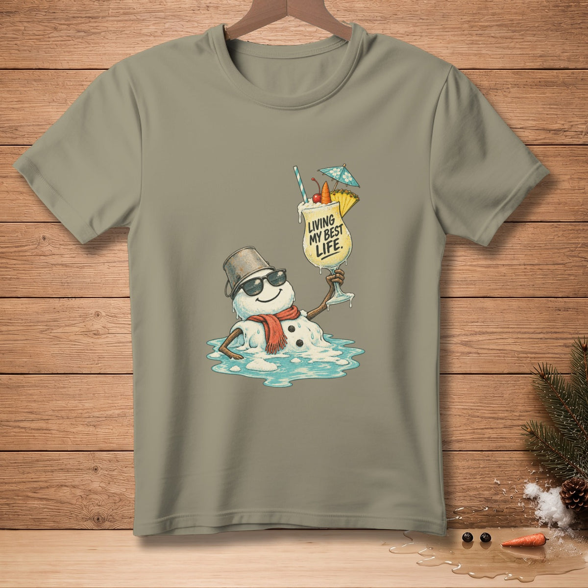 T-shirt graphic: melting snowman in sunglasses holding a cocktail, text reads "LIVING MY BEST LIFE."