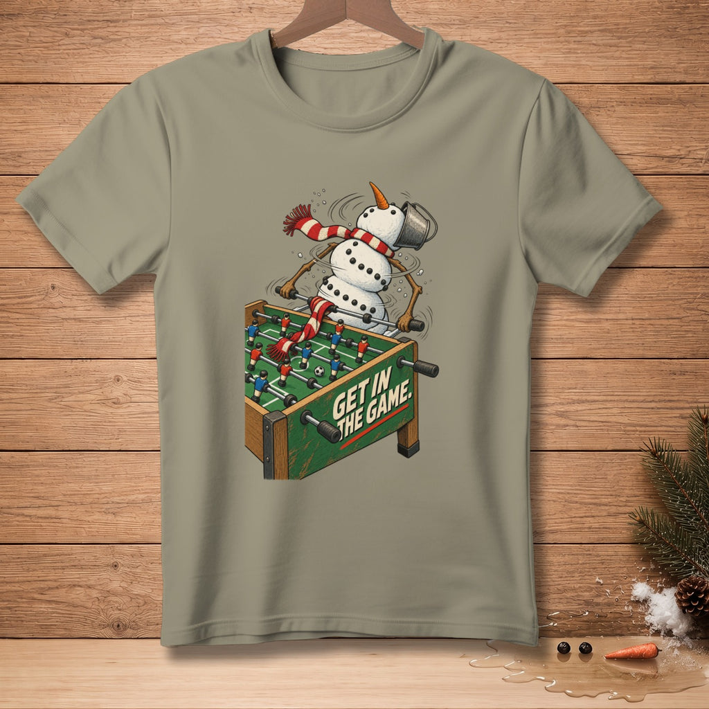 Snowman playing foosball with text "GET IN THE GAME" on t-shirt.