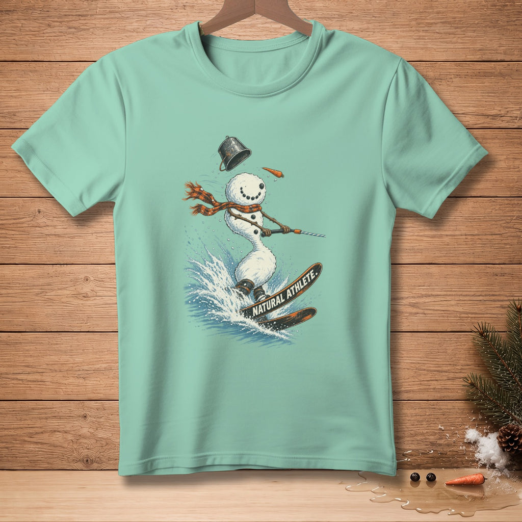 Light blue t-shirt with a graphic of a snowman skiing on skis with text "NATURAL ATHLETE."