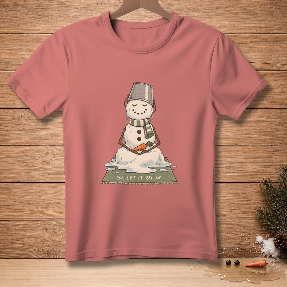Melting snowman meditating on a mat that says "LET IT GO."