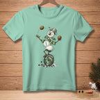 Mint t-shirt with a snowman juggling coconuts on a unicycle.
