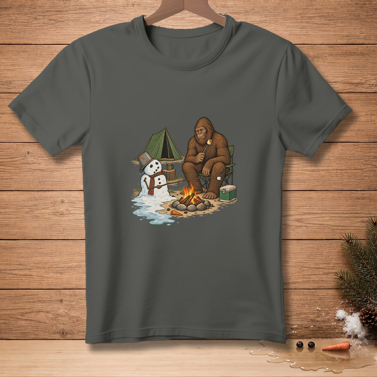 Bigfoot roasts a marshmallow by a campfire with a melting snowman nearby.