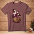Two snowmen in hats and scarves stand in a wine barrel overflowing with grapes.