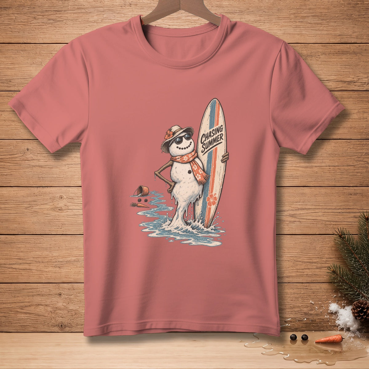 Snowman with sunglasses and scarf holding surfboard with text "Chasing Summer".