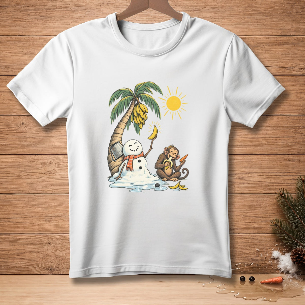 White t-shirt graphic of a melting snowman, banana tree, monkey, and sun.