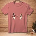 Two snowmen sitting at a table reading books by candlelight on a pink t-shirt.