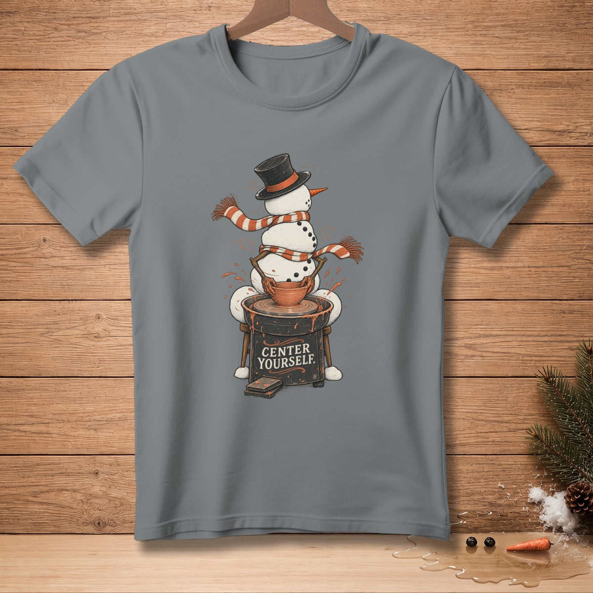 Snowman at pottery wheel with text "CENTER YOURSELF" on t-shirt.