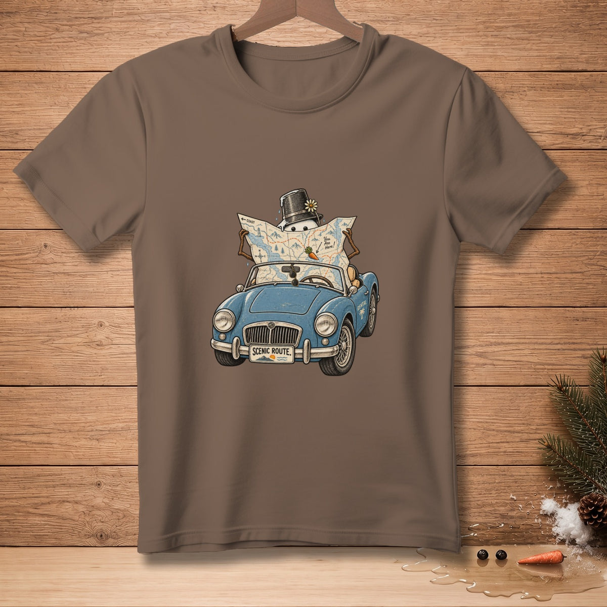 T-shirt graphic of a snowman in a top hat driving a blue convertible with a map.
