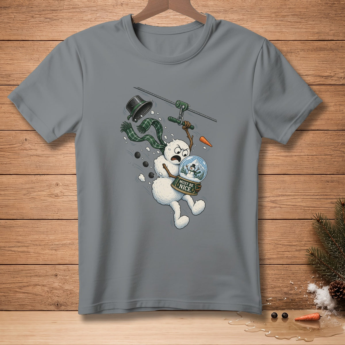 Snowman ziplining with a globe reading "Must Be Nice."