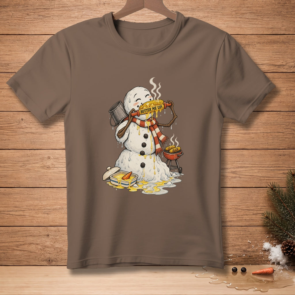 Snowman eating buttered corn on the cob, with a grill and butter dish.