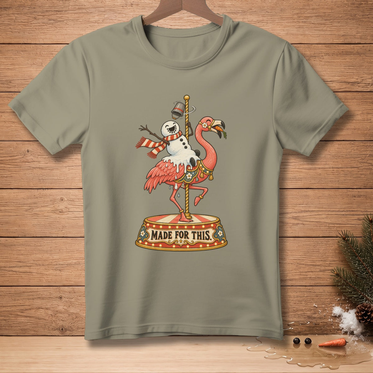 T-shirt graphic: flamingo and snowman on carousel, text "MADE FOR THIS".