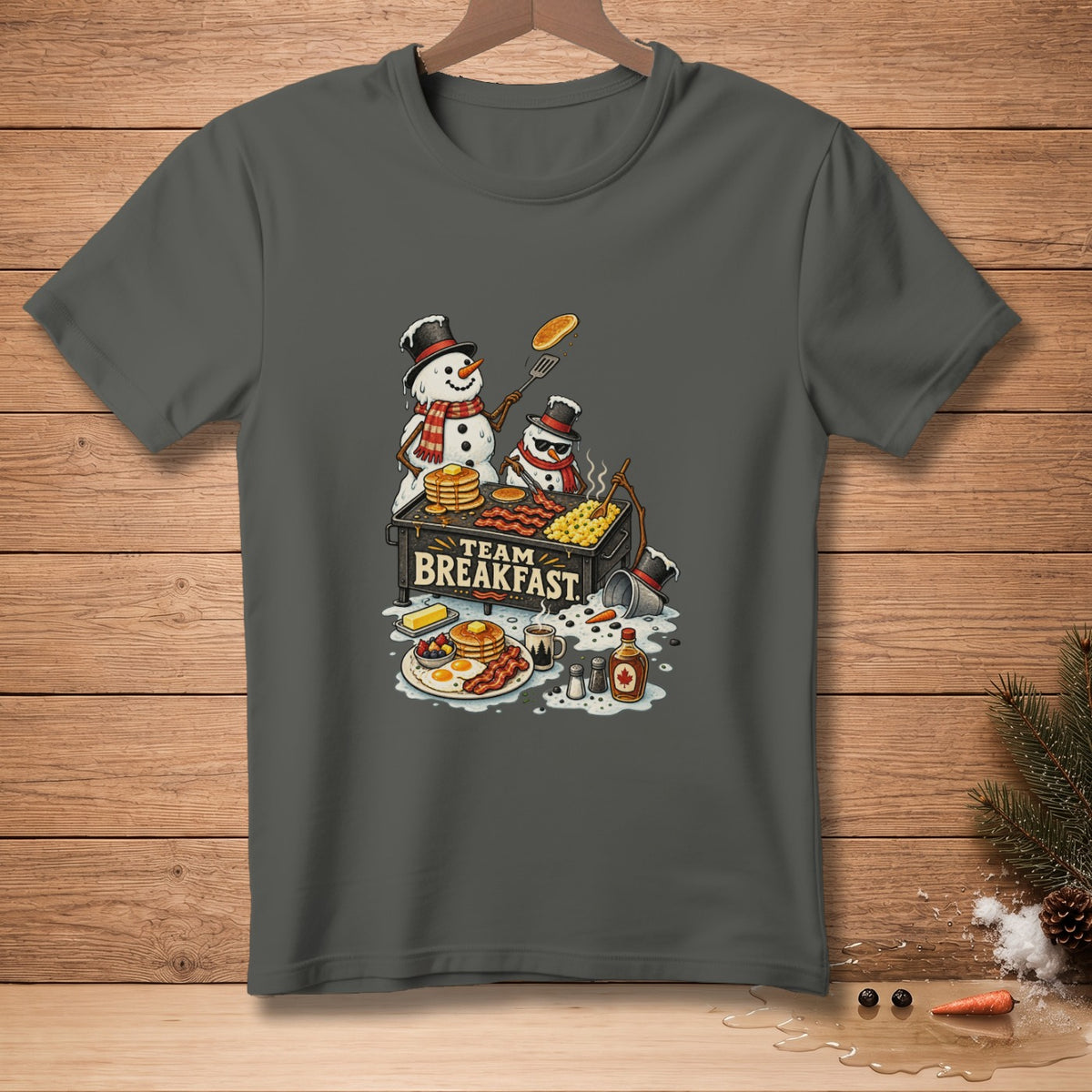 Two snowmen prepare breakfast on a grill with text "TEAM BREAKFAST."