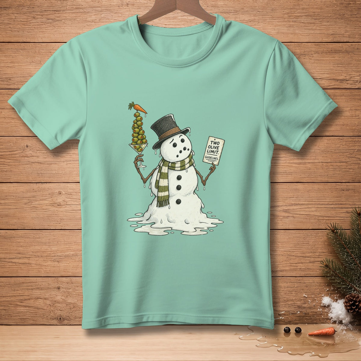 Snowman in a hat and scarf holding olives and a sign that reads "Two Olive Limit."