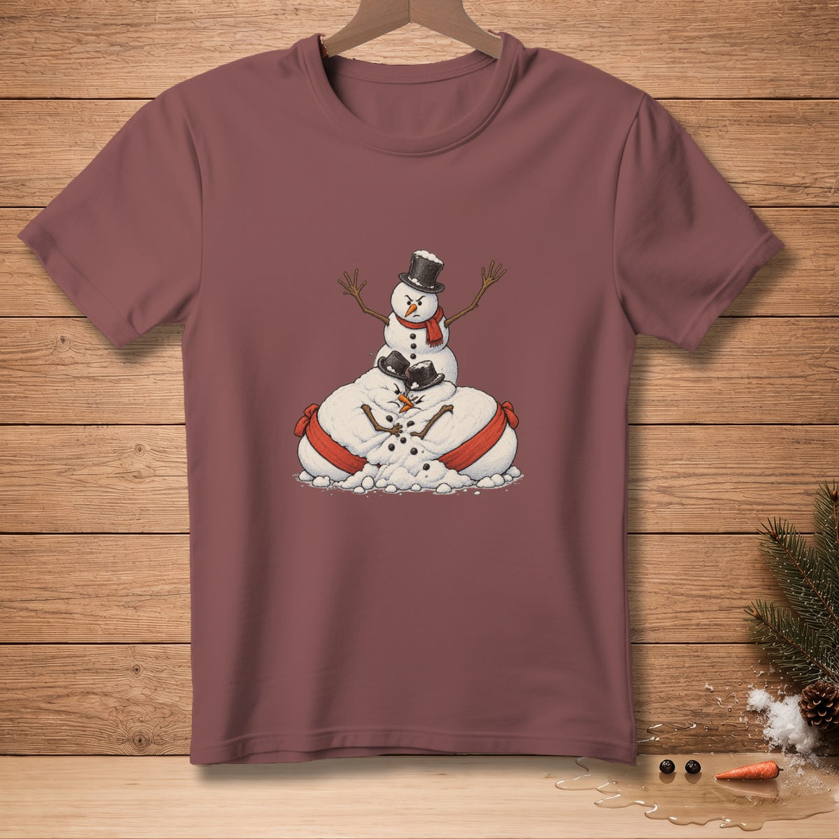 T-shirt with a cartoon illustration of three snowmen stacked and embracing.
