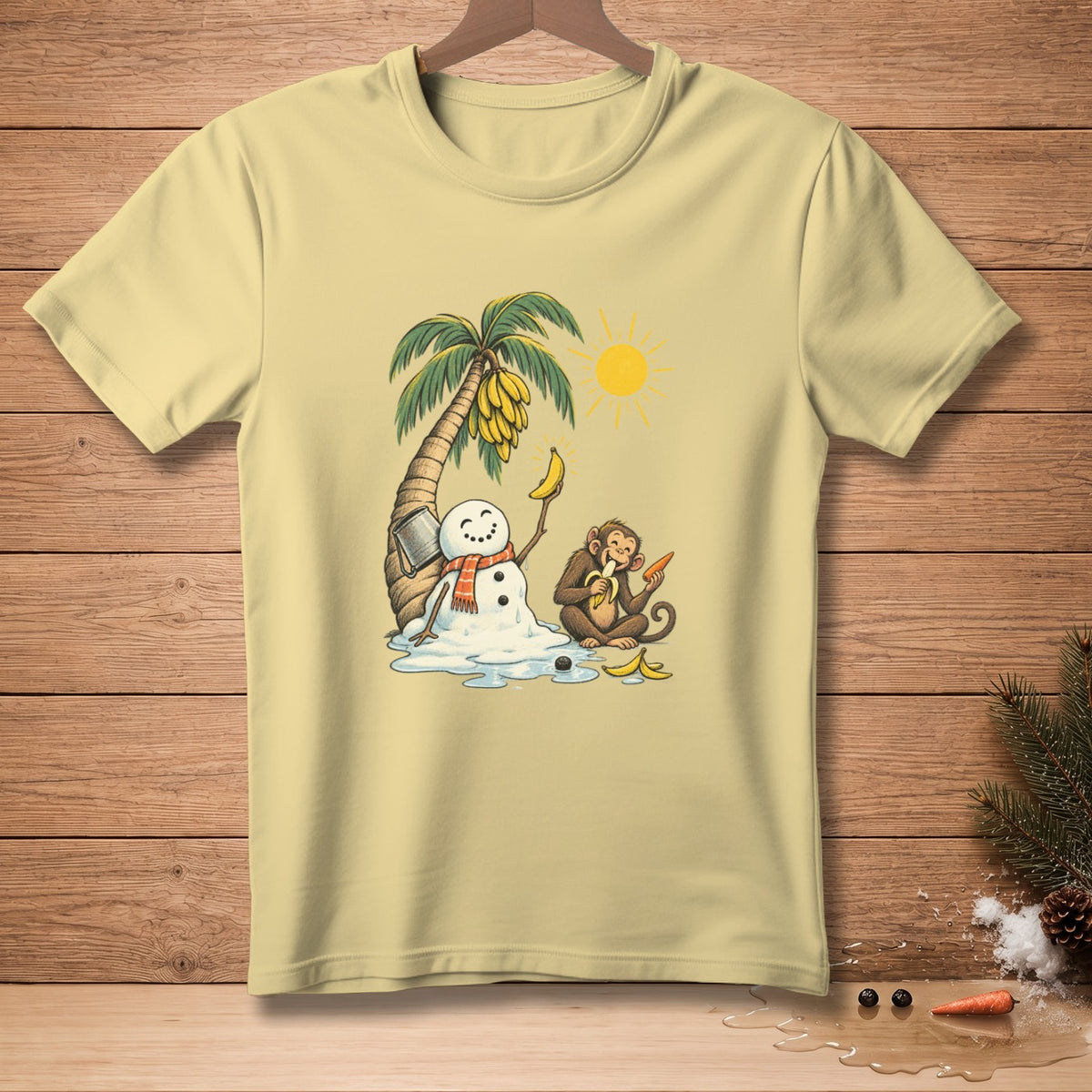 Illustration of a melting snowman and monkey under a palm tree on a tan t-shirt.