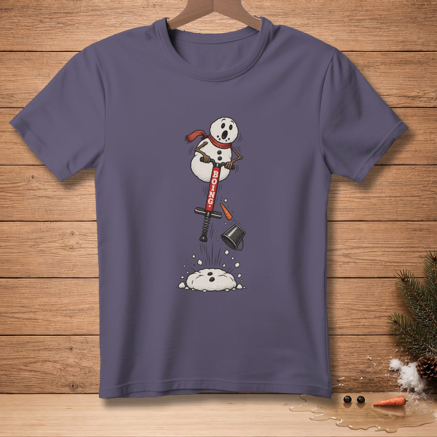 Snowman with red scarf on pogo stick, "BOING" text, on purple t-shirt.