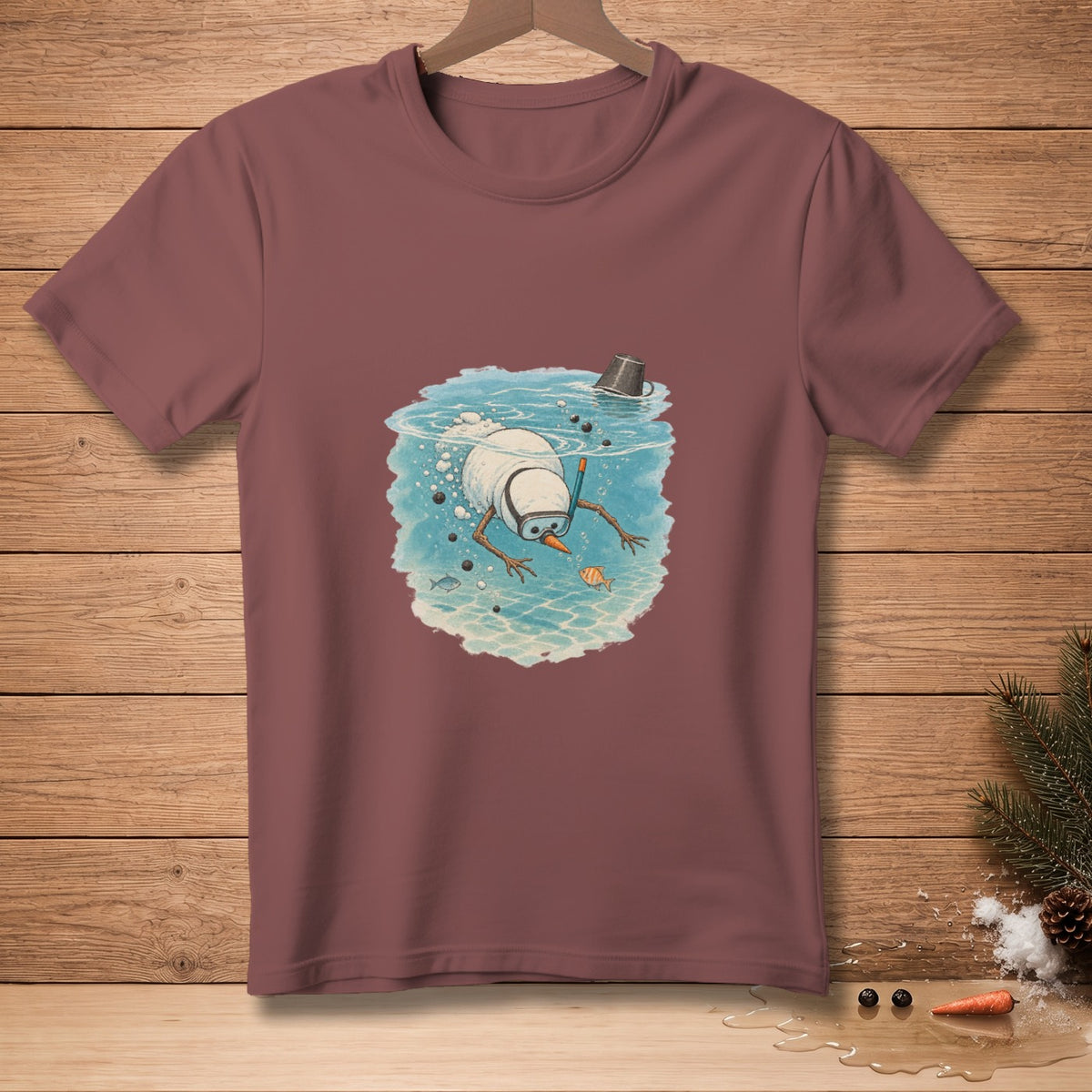 Snowman snorkeling underwater with fish and a bucket on maroon t-shirt.