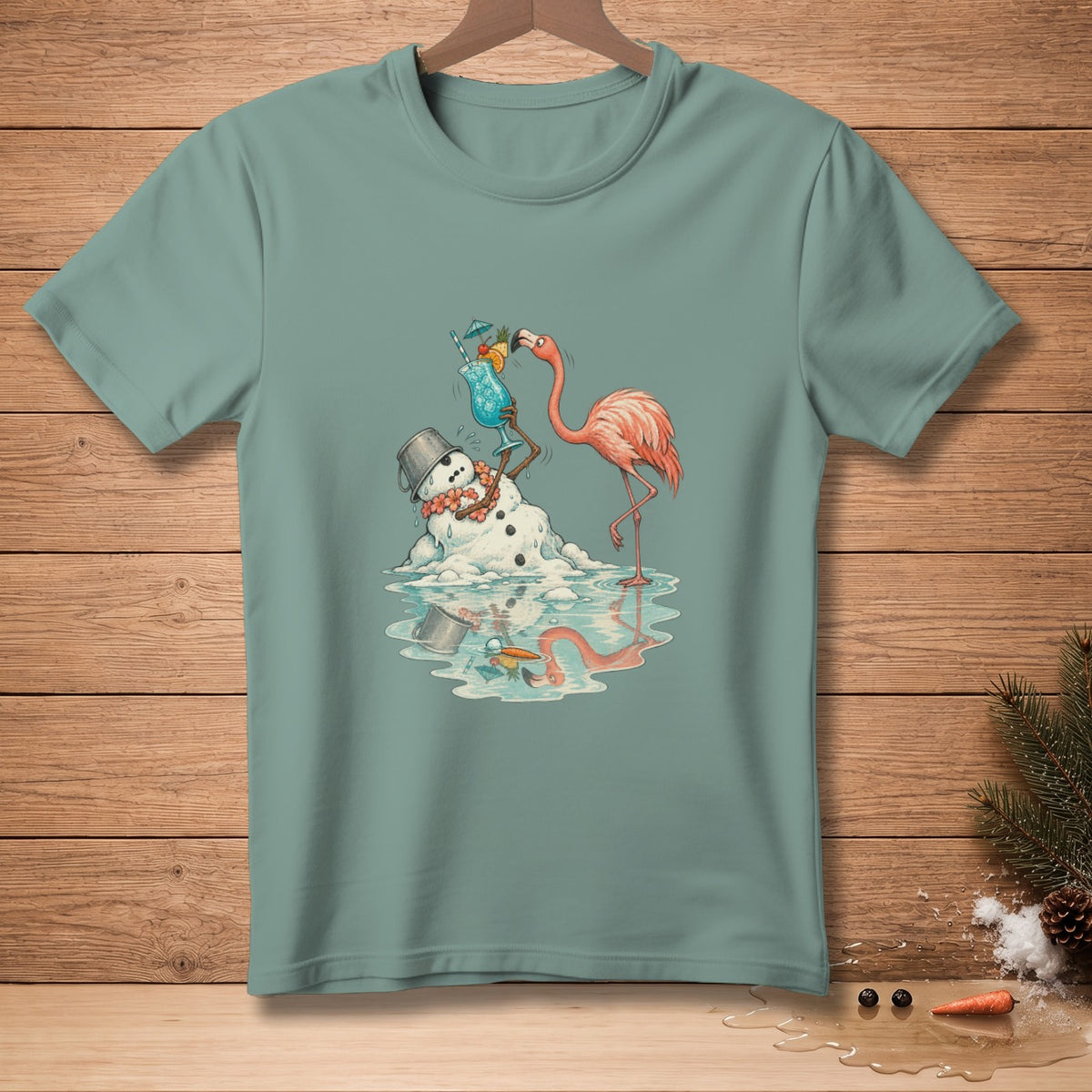 Flamingo holding drink with melting snowman and ice puddle on teal t-shirt.