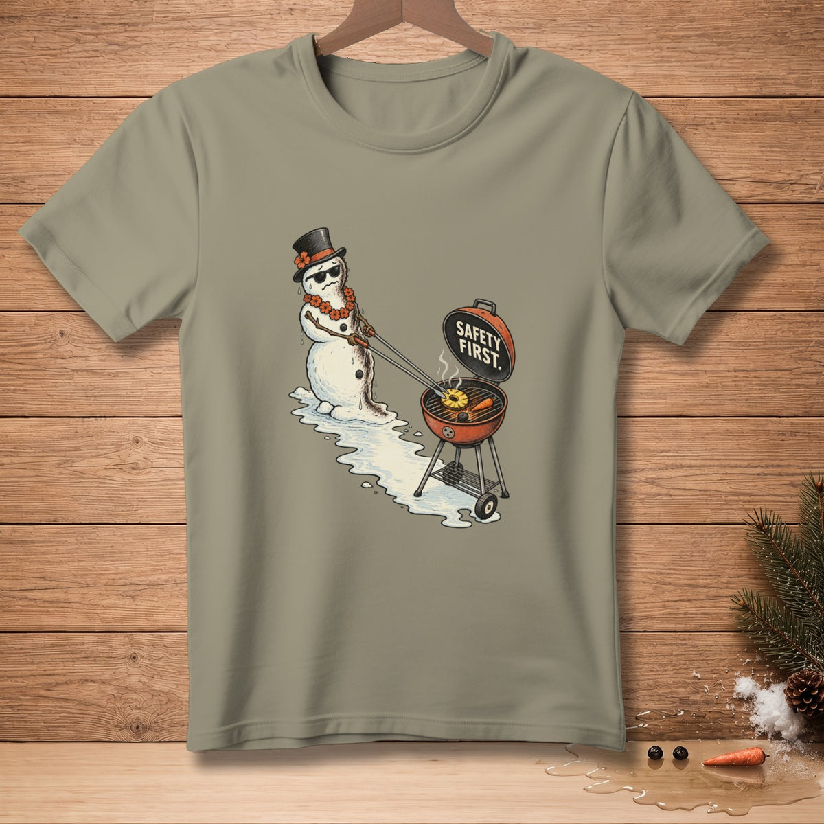 Snowman with sunglasses and top hat grilling pineapple, text "SAFETY FIRST."