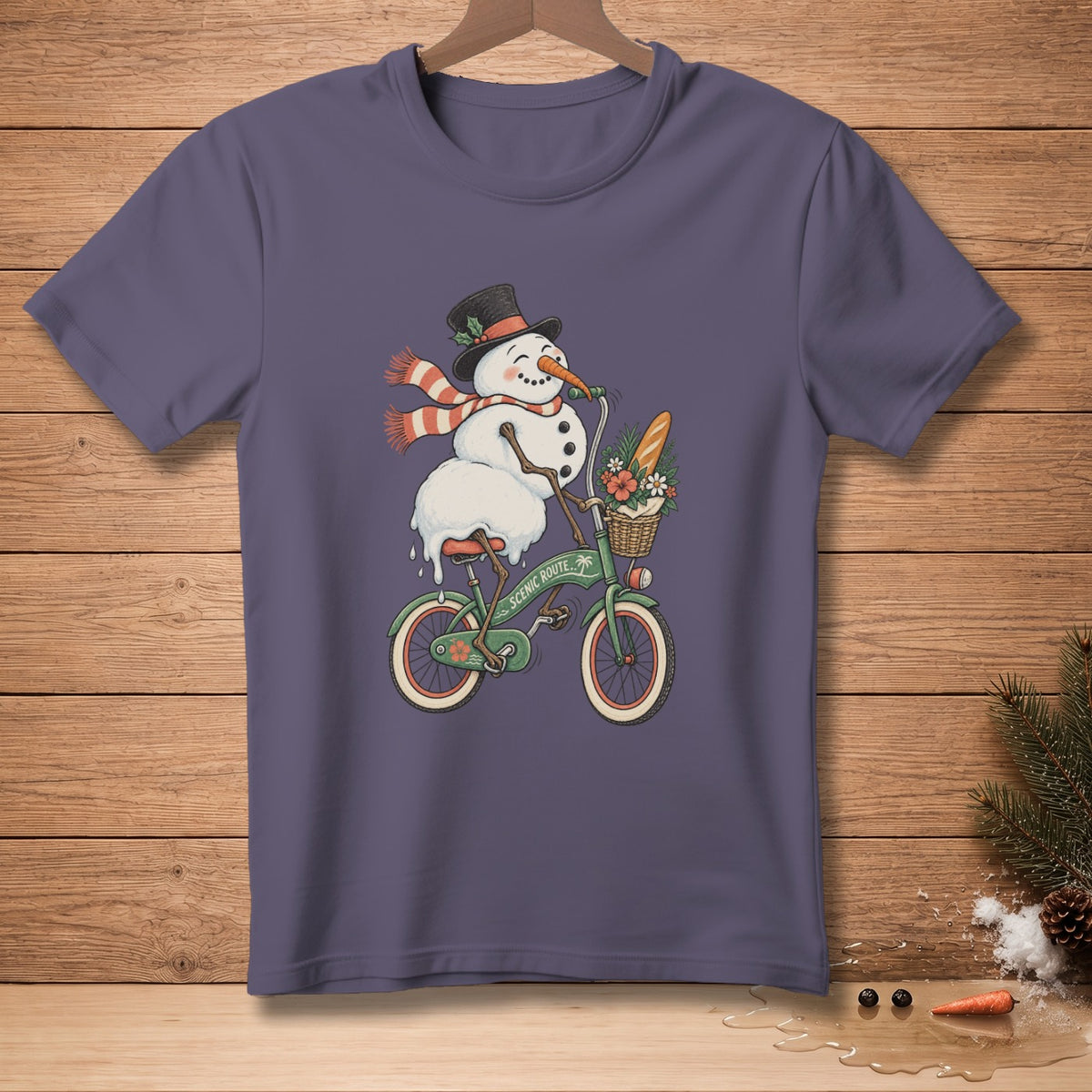 Snowman in hat and scarf riding bicycle with basket of flowers and baguette.
