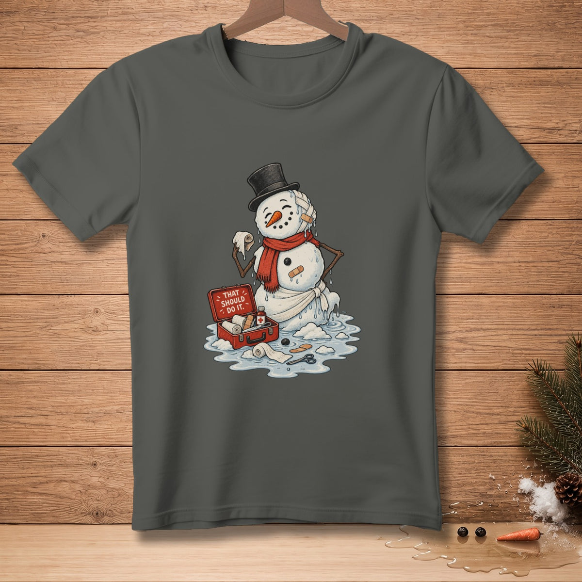 Melting snowman with bandages and first-aid kit, text "That should do it."