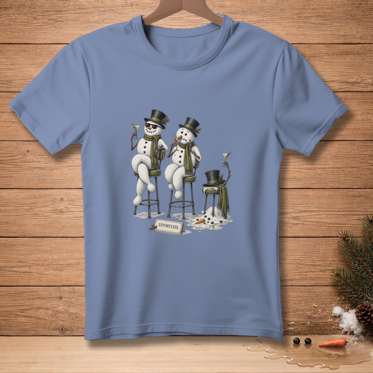 Two snowmen in top hats drink martinis, one melting, with "EFFORTLESS" sign.
