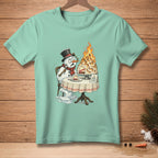 Melting snowman sits by a flaming baked Alaska cake on a table.