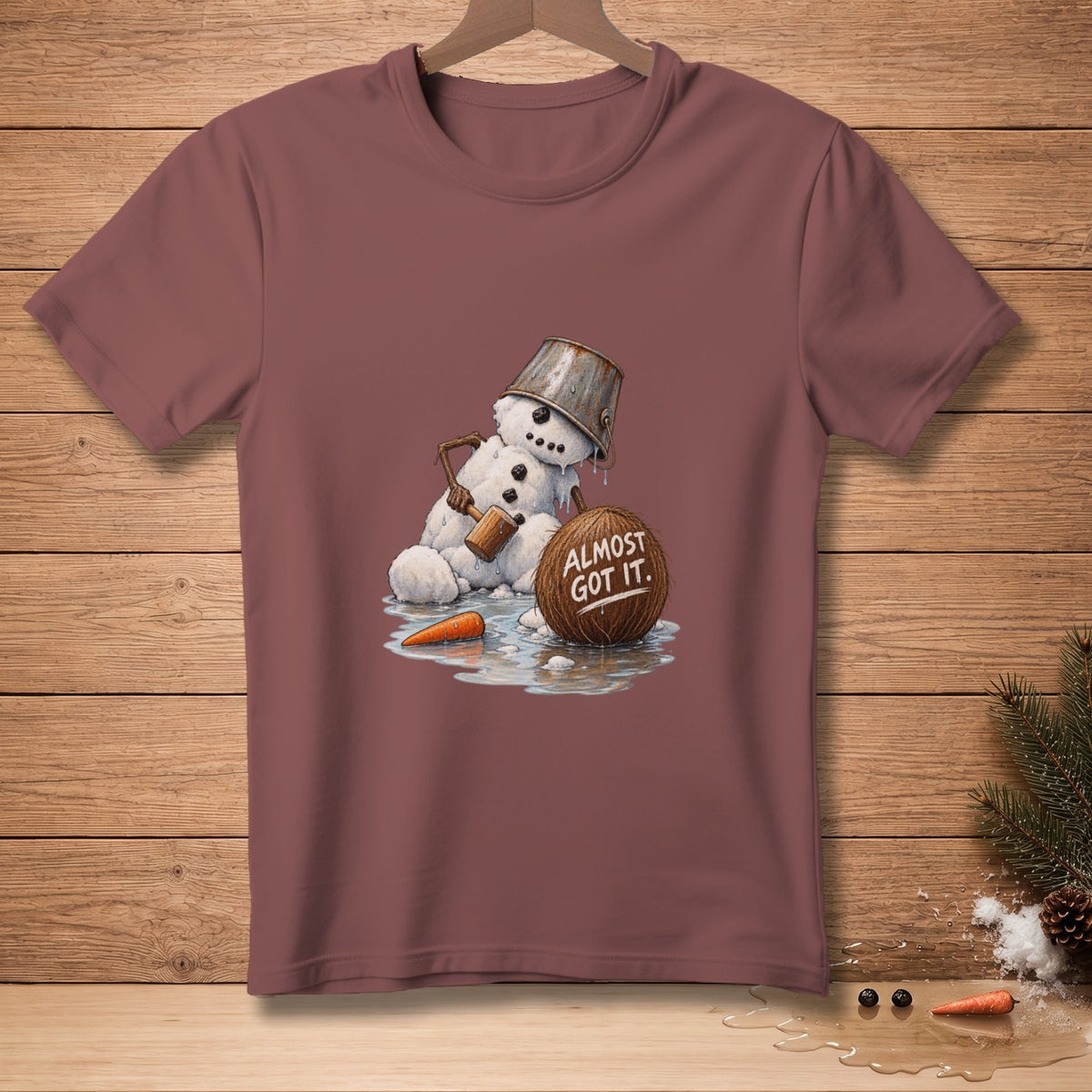 Snowman with a bucket on its head and a mallet, next to a coconut that reads "Almost Got It."