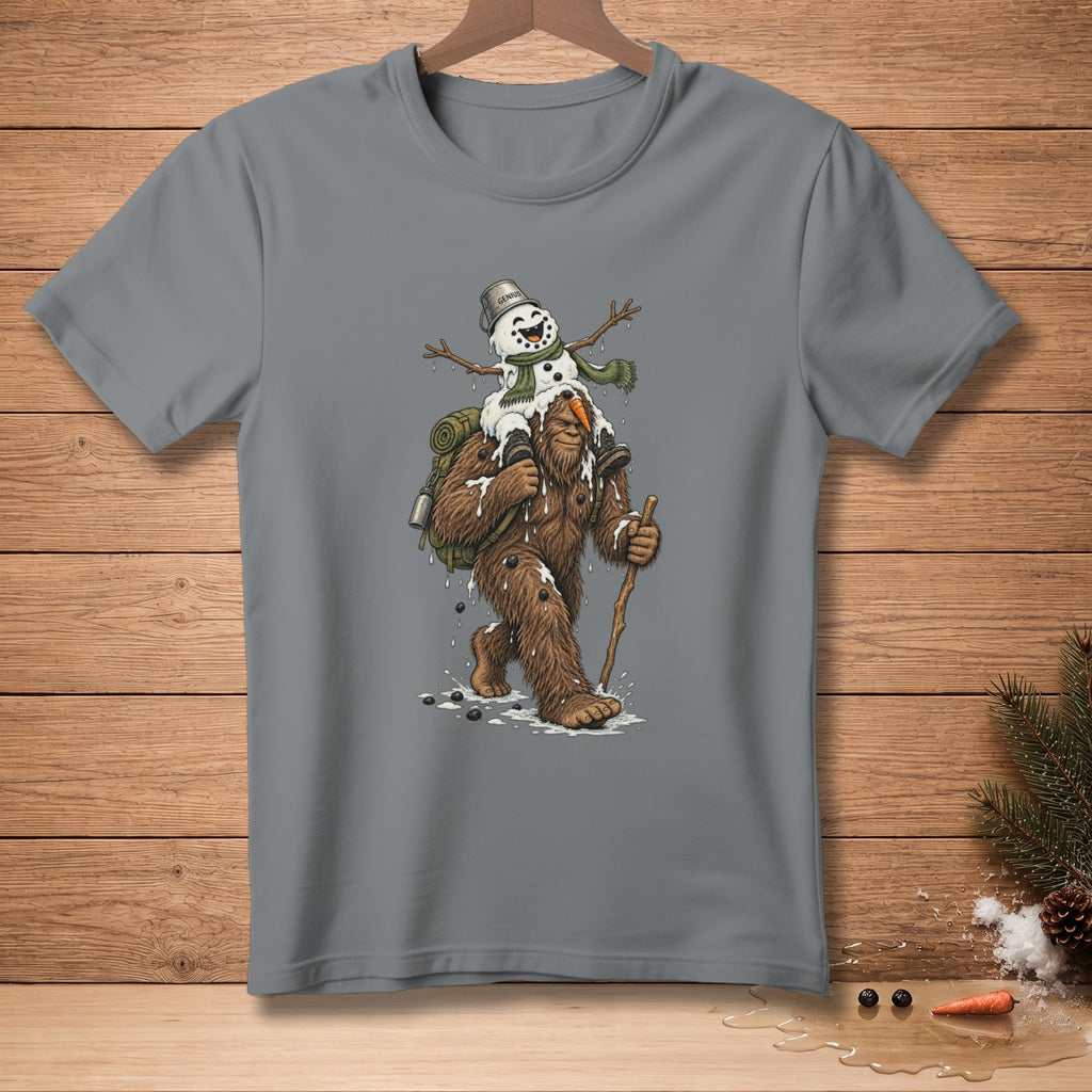 Bigfoot carrying a melting snowman with "genius" written on the bucket.