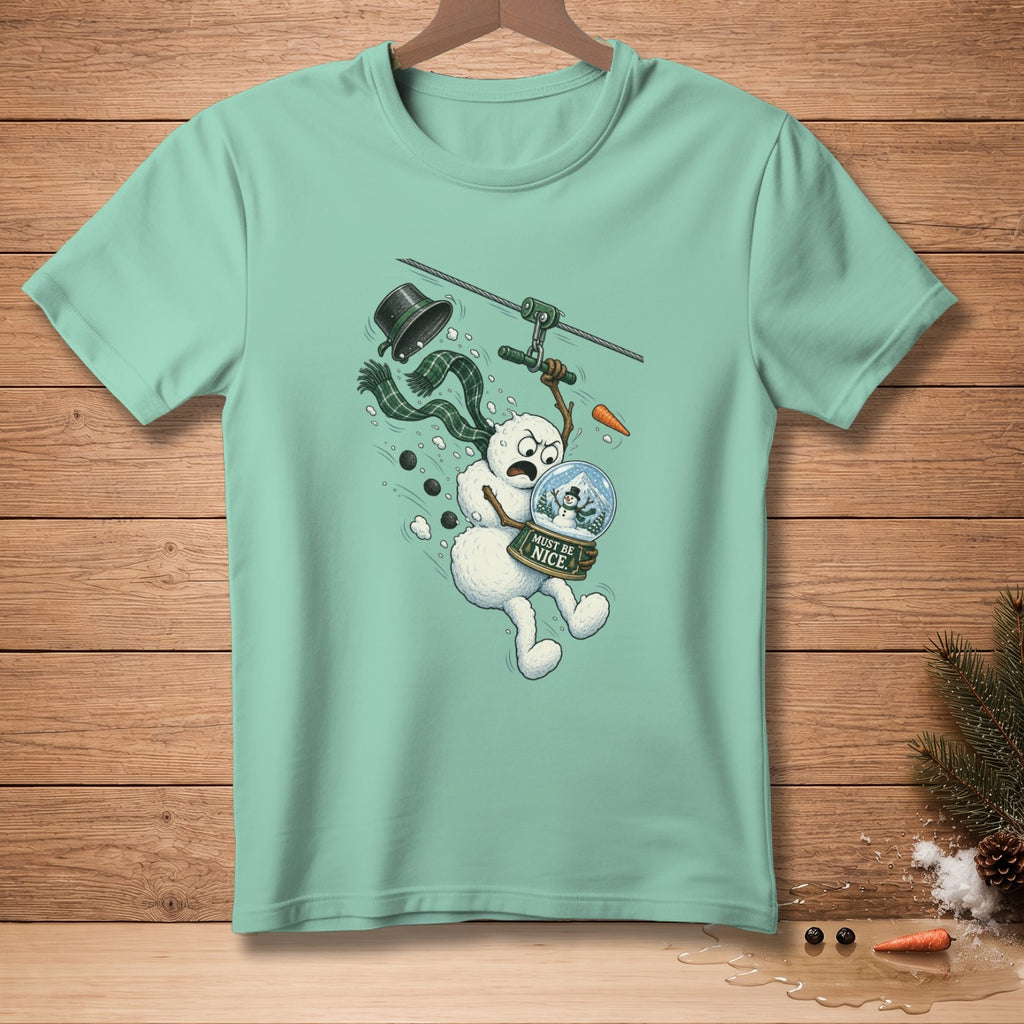 Snowman ziplining with snow globe labeled "Must Be Nice"