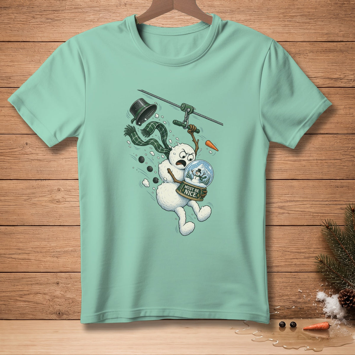 Snowman ziplining with snow globe labeled "Must Be Nice"