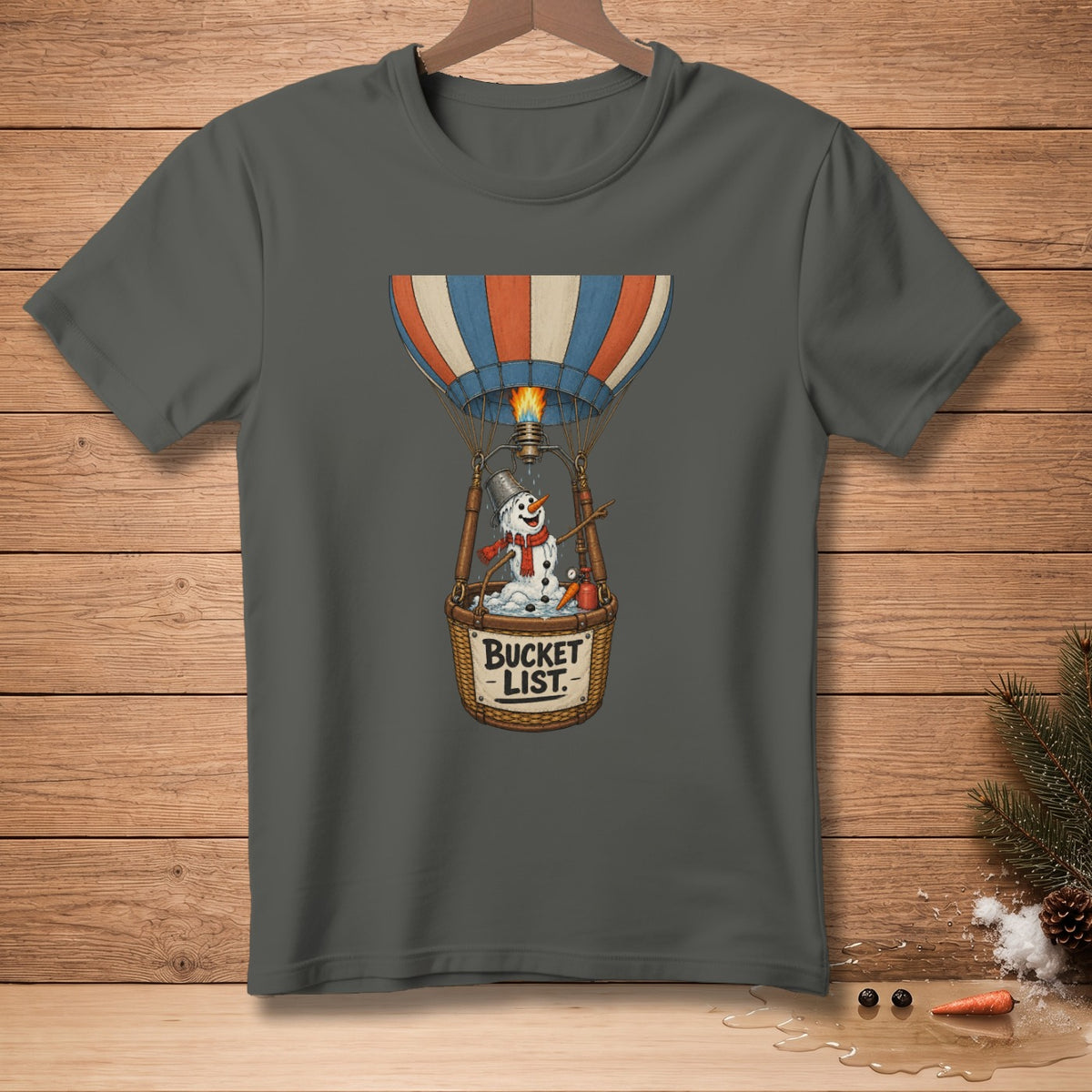 T-shirt graphic of snowman in hot air balloon with "Bucket List" text.